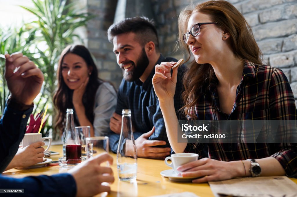 Happy young friends hangout in coffee shop Happy young friends hangout together in coffee shop Friendship Stock Photo