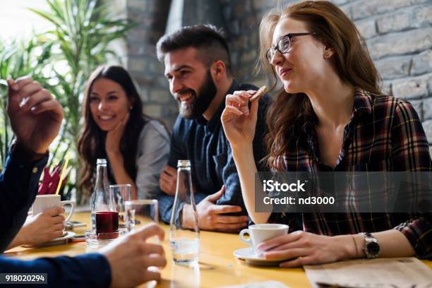 Happy Young Friends Hangout In Coffee Shop Stock Photo - Download Image Now - Friendship, Connection, Restaurant