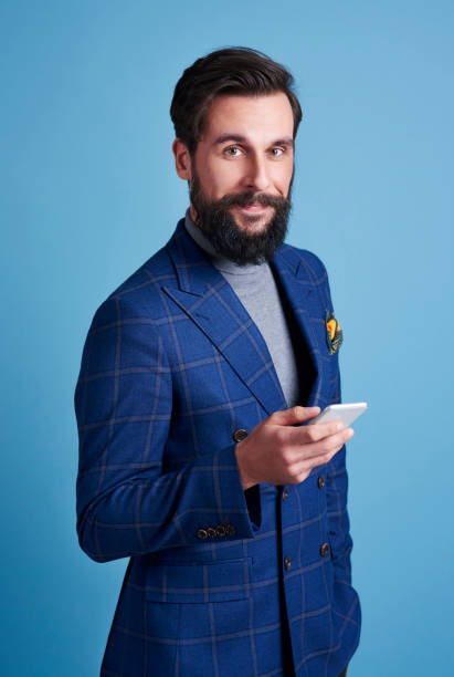 istock Businessman with mobile phone at studio shot 918020718