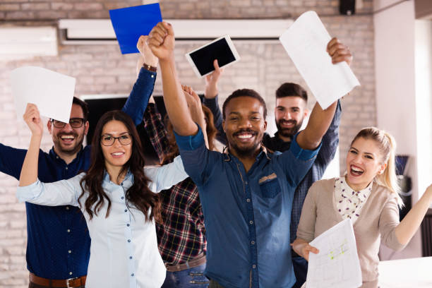 istock Group of successful young architects posing in office 918021336