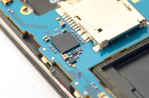 istock Disassembly of smartphone showing electrical board inside. The phone is fixing 918025008