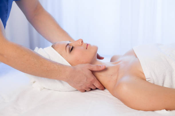 istock beautiful girl make massage therapy neck in Spa 918030662