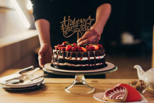 istock woman putting Happy Birthday sign 918032006