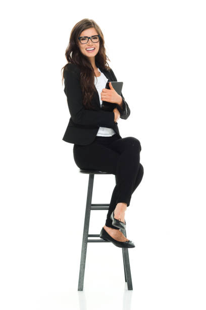 istock Businesswoman sitting on stool 918032182