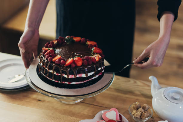 istock woman taking piece of cake 918039146