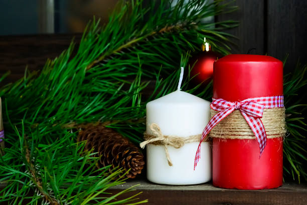 istock Candle on the table near the Christmas tree. Christmas present 918039522