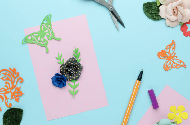 istock bright pink postcard with paper flowers on blue background 918041900