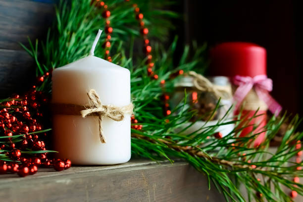 istock Candle on the table near the Christmas tree. Christmas present 918042224