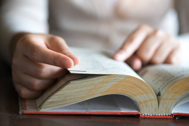 istock Woman reading ta book.reading bible, 918043064
