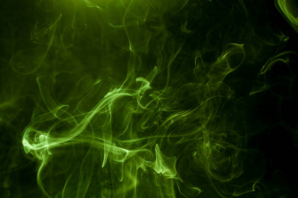 istock Green smoke on a black background. smoke on a black background. 918045780