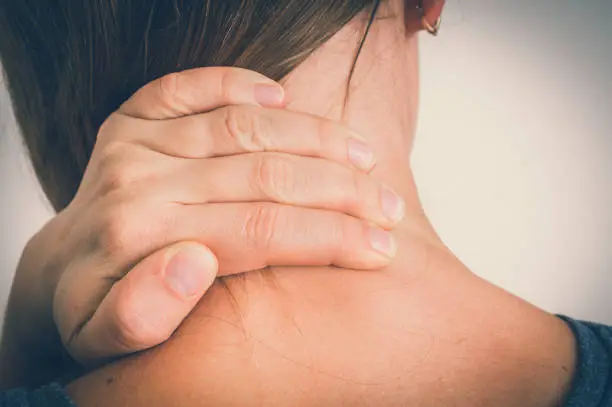 Woman with muscle injury having pain in her neck - body pain concept
