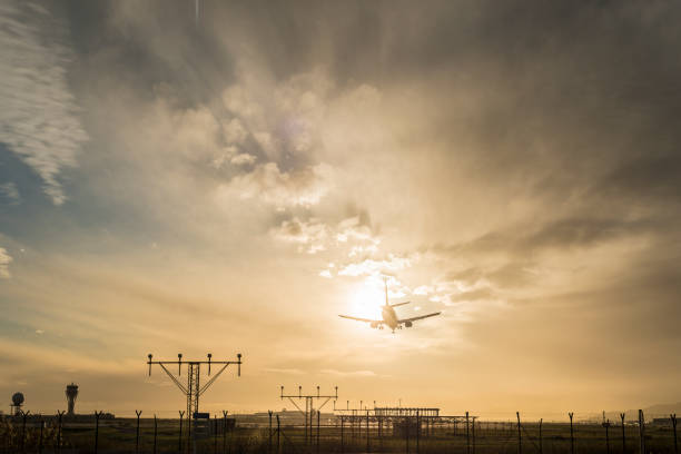 istock Airplane landing at dusk. 918048738