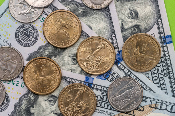 istock dollar bills and coin close up 918049806