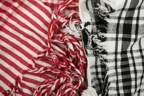 Two background texture, pattern. Scarf. The Palestinian keffiyeh checkered red and white against black and white scarf that is usually worn around the neck or head.