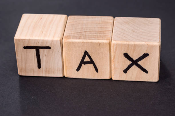 istock text tax on wooden cubes isolated on black 918050158