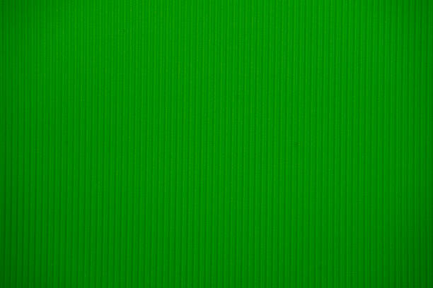 istock Light green colored corrugated cardboard texture useful as a background 918050358