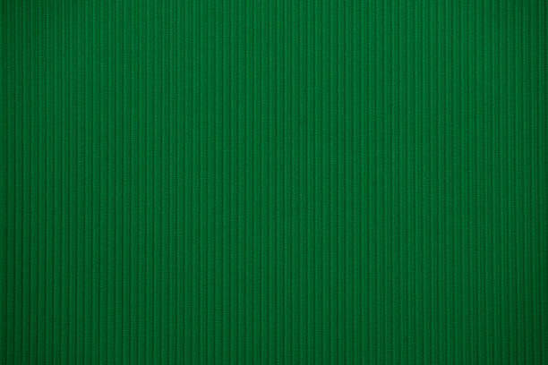 istock Dark green colored colored corrugated cardboard texture useful as a background 918050460