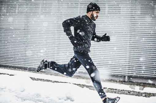 Male Athlete Exercising Outdoors in Winter