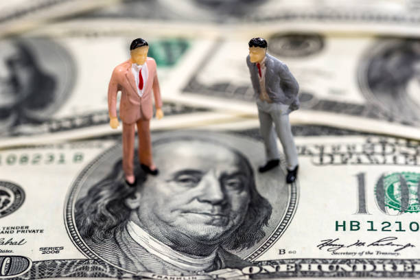 istock toys people on one hundred dollar denominations 918053544