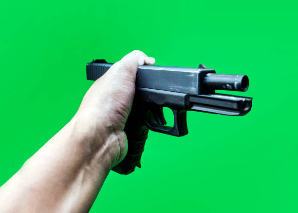 istock hand hold short gun to detect evidance 918053572
