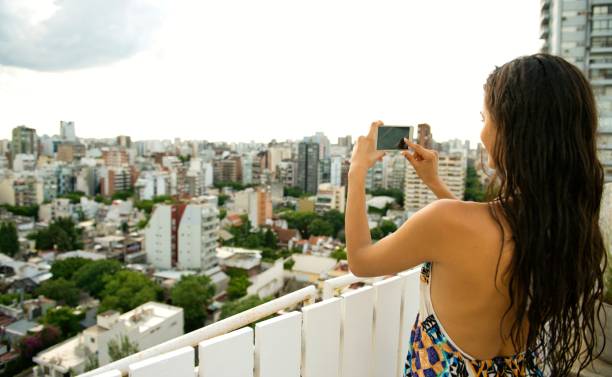 istock Beautiful woman taking a photo. 918053918