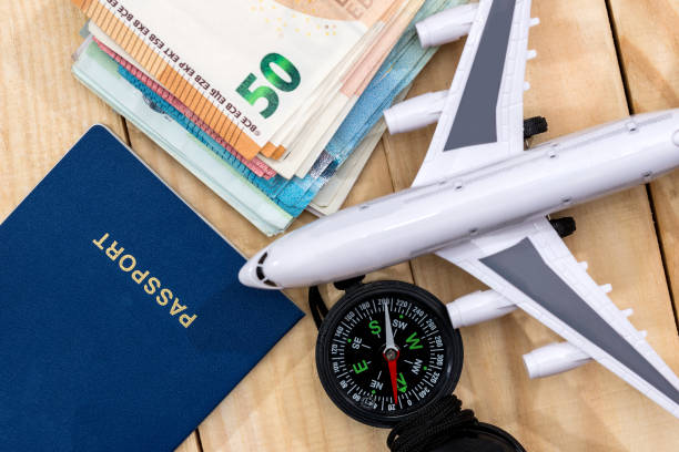 istock Preparing for a trip concept, an airplane money passport 918056678