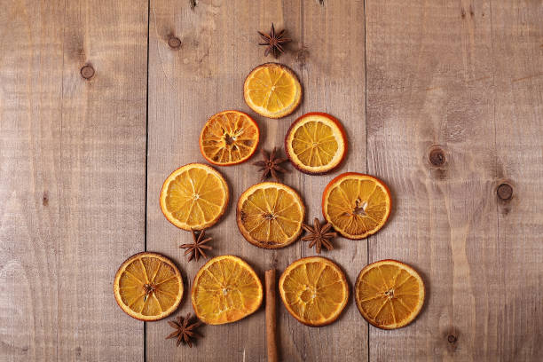 istock Dry slices of oranges lying on the table. Decorative ornament. C 918057252