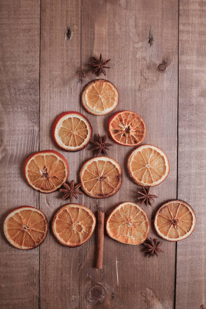 istock Dry slices of oranges lying on the table. Decorative ornament. C 918057276