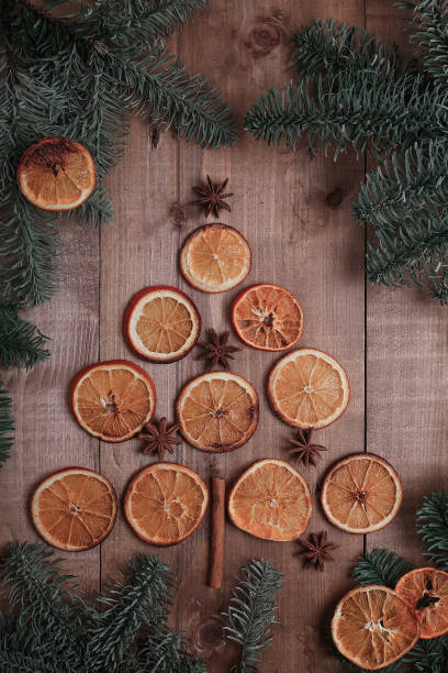 istock Dry slices of oranges lying on the table. Decorative ornament. C 918057352