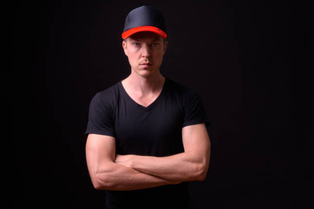 istock Portrait Of Man Against Black Background 918060650
