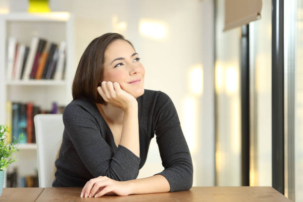 istock Homeowner dreaming looking above at home 918068548