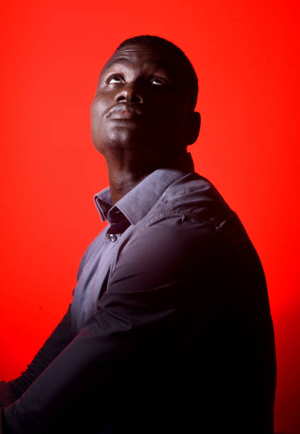 istock portrait of a african man on red background 918069436