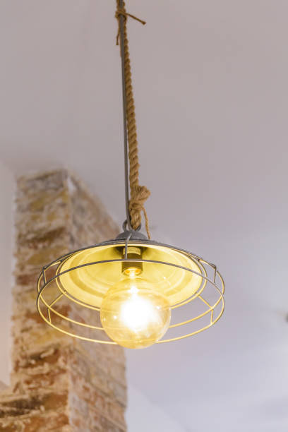 istock Old Light Fixture Hung by Rope 918070764
