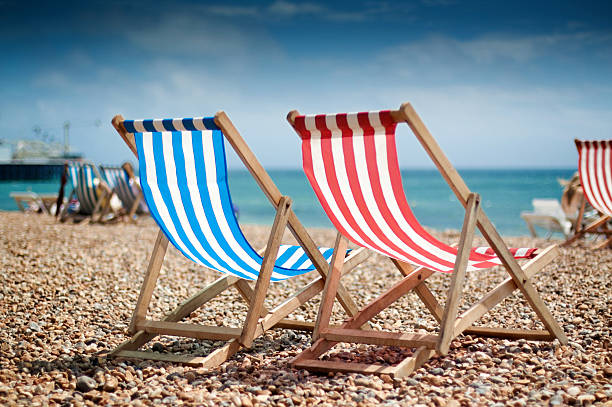 istock Close up of two deck-chairs on the beach 91807575