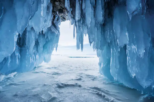 Winter Landscape, Frozen ice cave with bright sunlight from way out at lake Baikal in Irkutsk, Russia