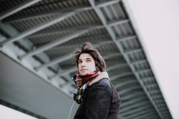 istock Young man enjoying some music outdoors 918078862