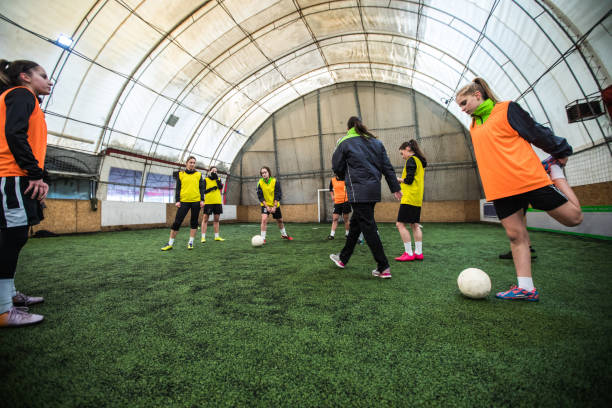 istock Coaching girls soccer team 918079310