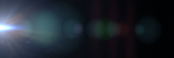 istock intense blue lens flare effect overlay texture panorama with bokeh effect and light streak in front a black background 918079908