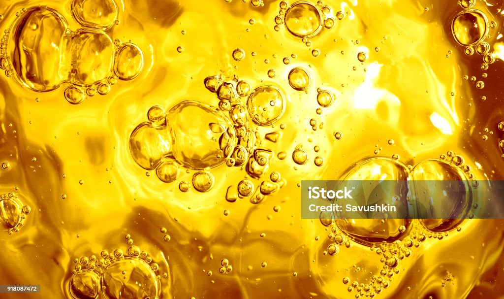 Surface of a liquid Surface of a liquid with bubbles. Cooking Oil Stock Photo