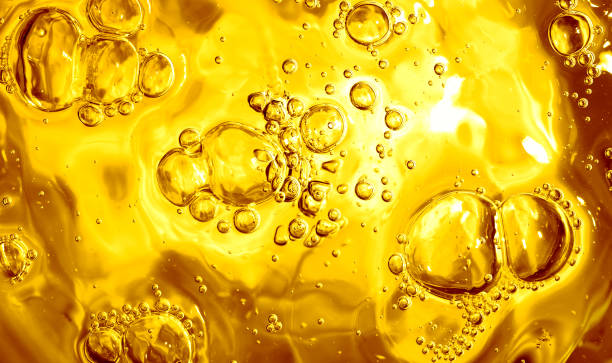 Surface of a liquid Surface of a liquid with bubbles. cooking oil photos stock pictures, royalty-free photos & images