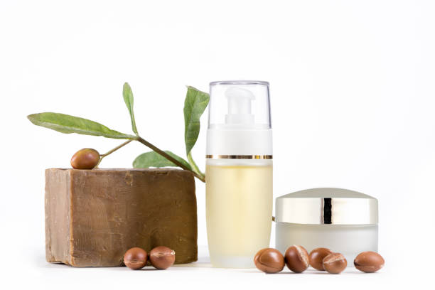 Cosmetic products and argan fruits stock photo