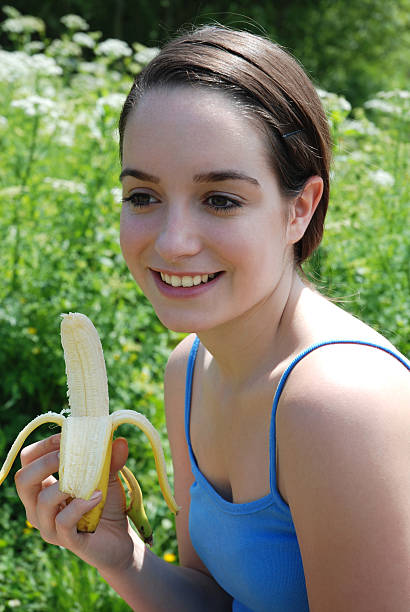 Woman with banana stock photo