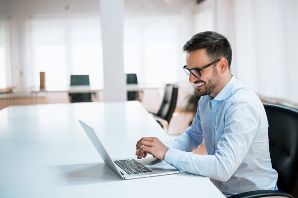 istock Handsome businessman working with laptop in office 918091028