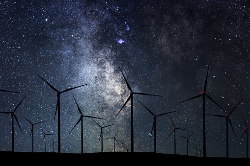 Night Sky Over Wind Farm. Energy and nature Night Sky.