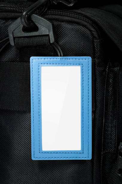 istock Blue leather hanging tag on travel bag background. Blank name tag for your design. 918094830