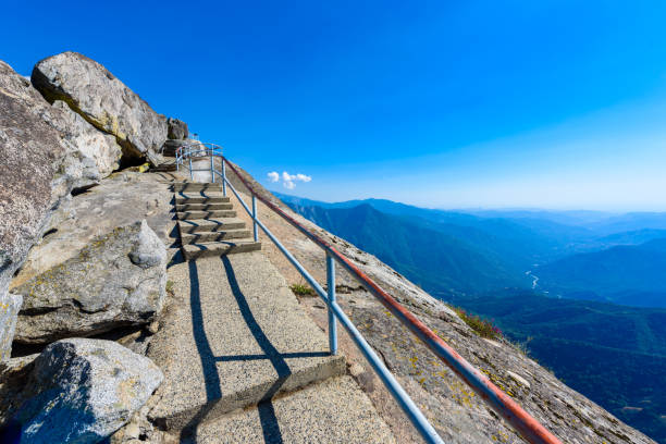 Hike on Moro Rock Staircase toward mountain top, granite dome rock formation in Sequoia National Park, Sierra Nevada mountains, California, USA