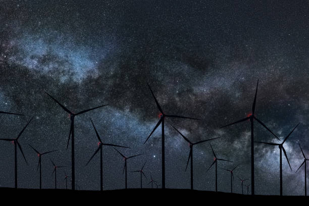 istock Night Sky Over Wind Farm. Energy and nature Night Sky. 918099388