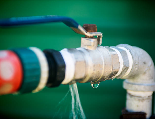 istock Water leaking from a irrigation pipe faucet 918099596