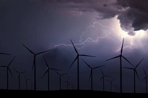 istock Storm Night Over Wind Farm. Energy and nature Night Sky. 918099706