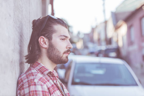 istock Modern young man posing on the street. 918099932